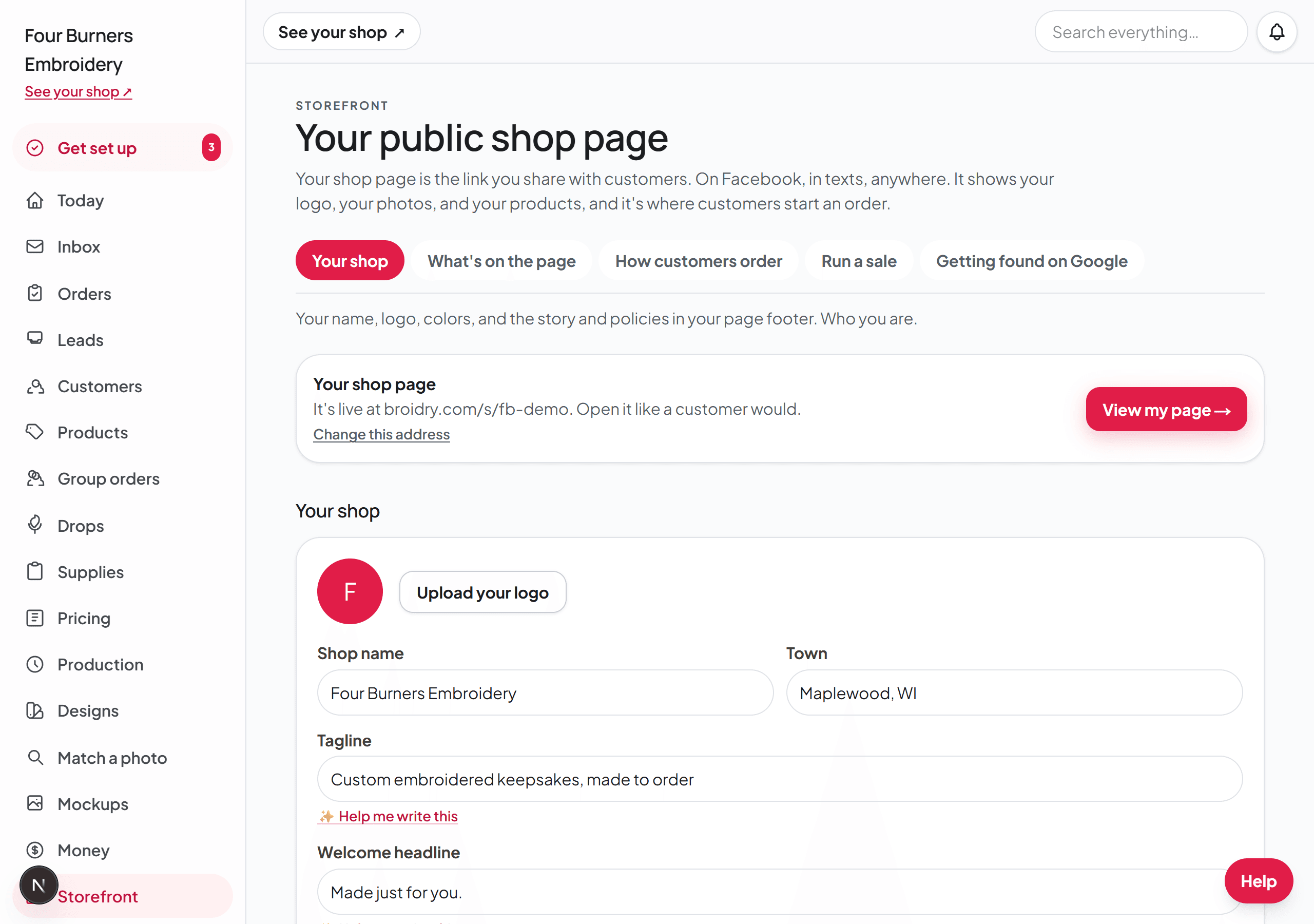 The Storefront page on its Your shop tab, showing the five tabs, the shop address card with Change this address, and the name and tagline fields.
